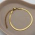 Platte gouden armband met een snake schakel